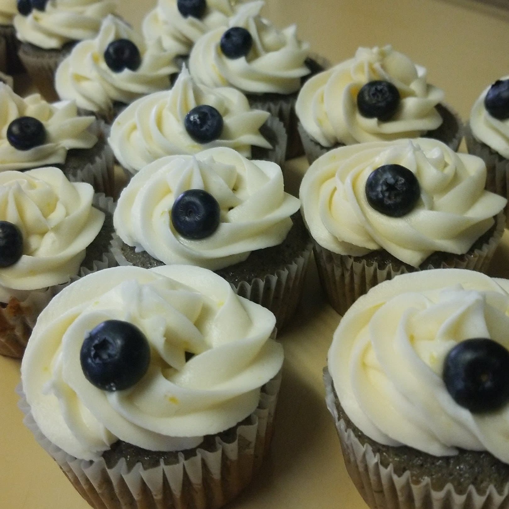 Close-up of blueberry buttercream cupcakes by Jamie Cakes.