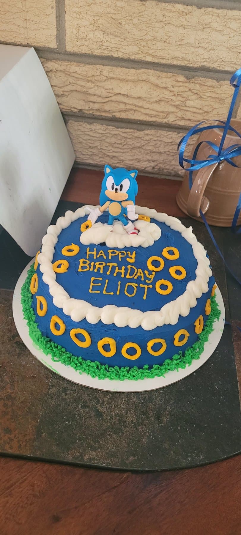 Colorful themed birthday cake with playful toppers by Jamie Cakes.